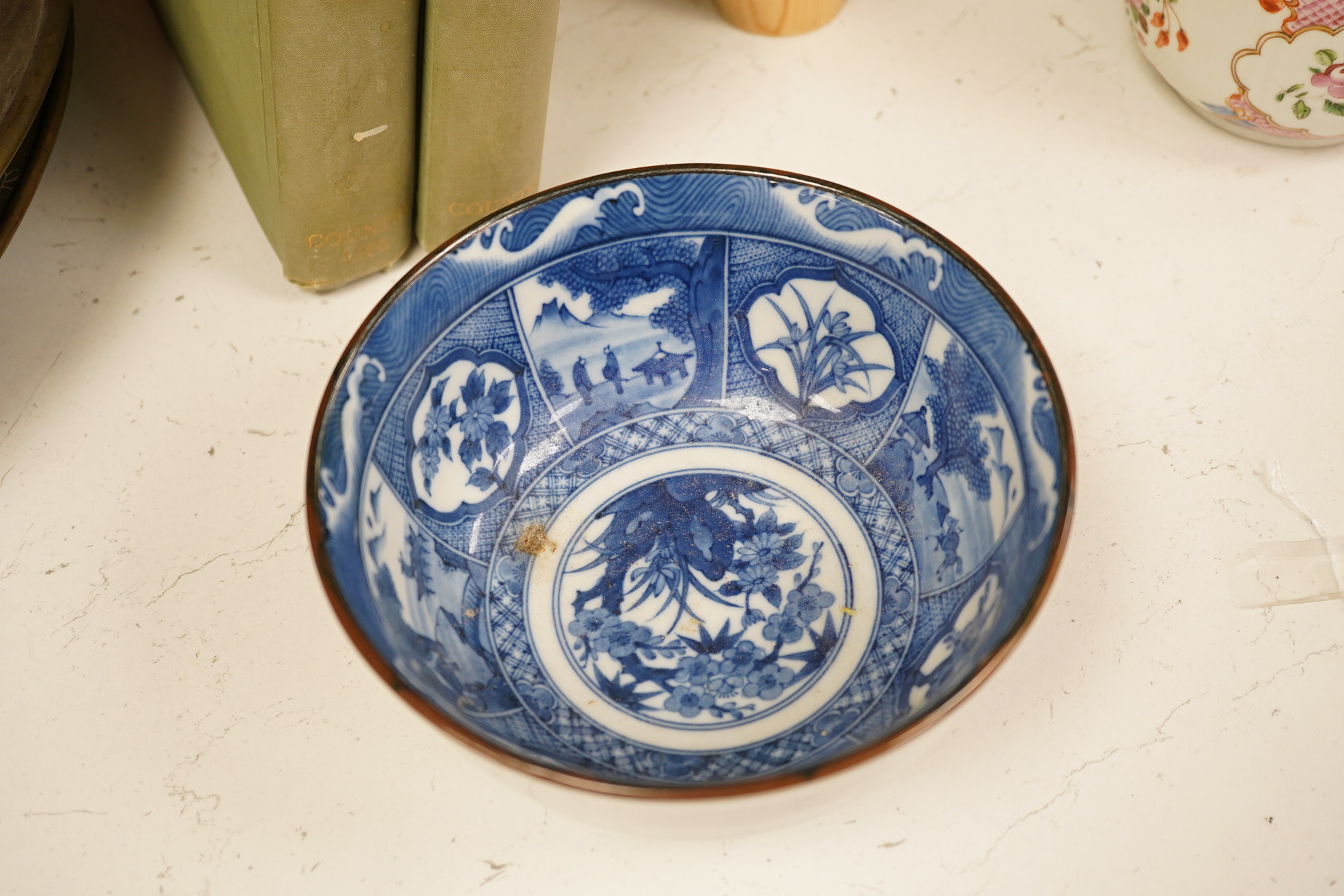 A group of Chinese blue and white porcelain, including a mid 19th century Canton enamel teabowl and a Japanese small dish, tallest 22cm. Condition - fair